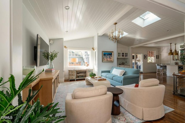 living room featuring wooden ceiling, vaulted ceiling with skylight, an inviting chandelier, and hardwood / wood-style flooring