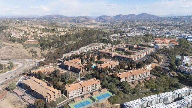 birds eye view of property with a mountain view