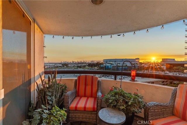 view of balcony at dusk