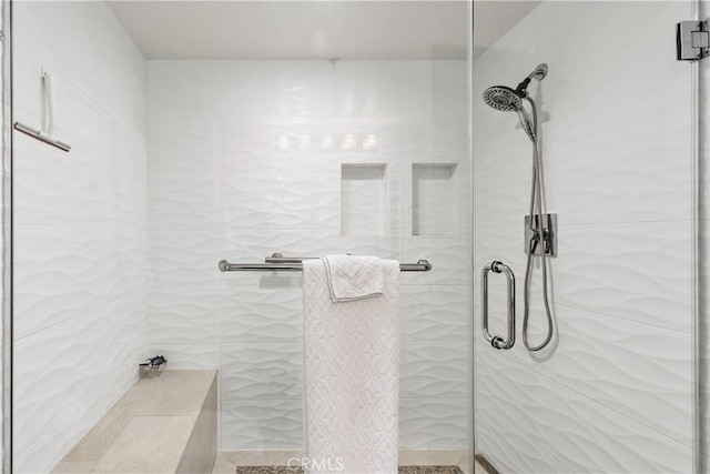 bathroom with a shower with shower door