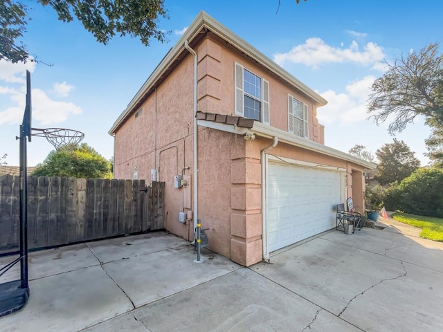 view of property exterior with a garage