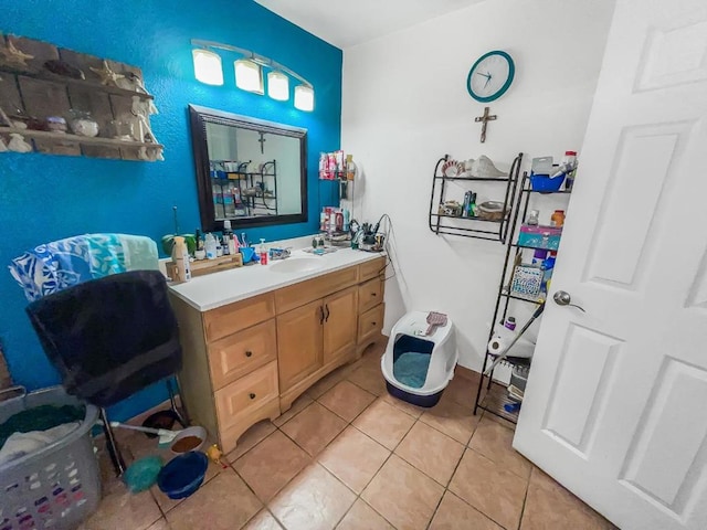 bathroom with tile patterned flooring and vanity