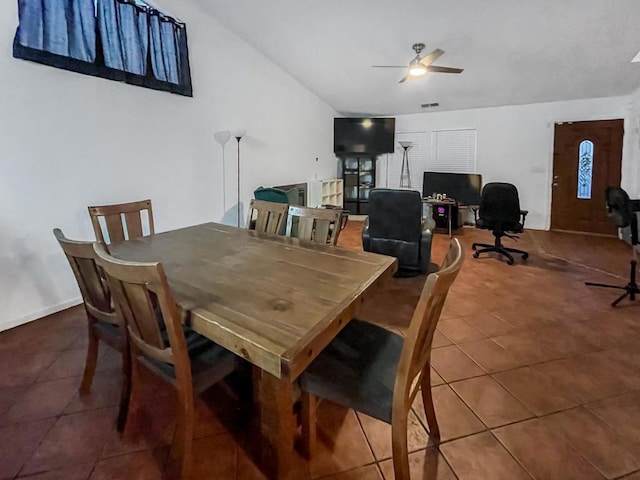 dining area with tile patterned flooring and ceiling fan