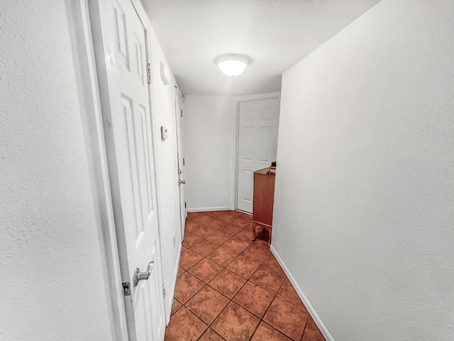 hallway featuring tile patterned floors