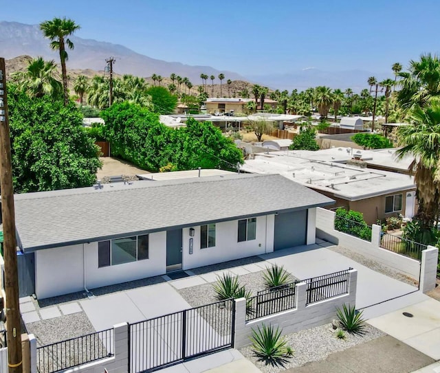 view of front of home featuring a mountain view