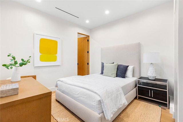 bedroom featuring light hardwood / wood-style floors