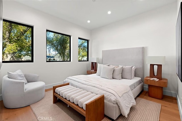 bedroom with light hardwood / wood-style flooring