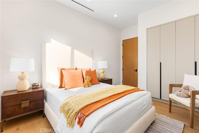 bedroom with light wood-type flooring