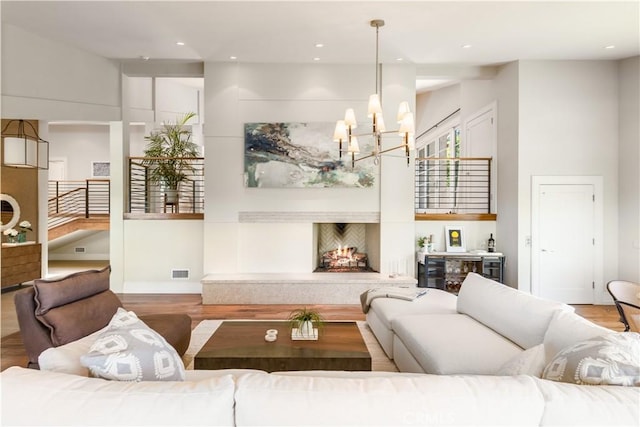 living room featuring hardwood / wood-style floors and a chandelier