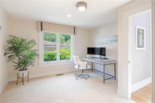 carpeted office space featuring ornamental molding