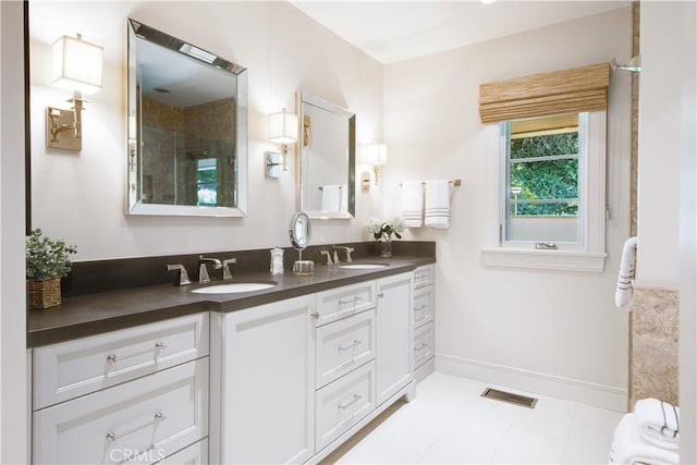 bathroom featuring vanity and a shower