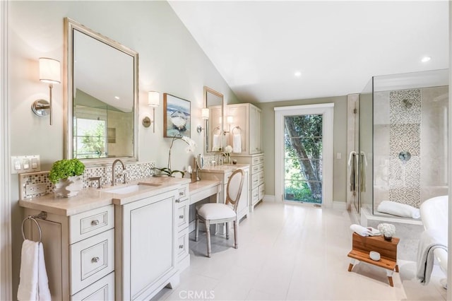 bathroom with decorative backsplash, an enclosed shower, vanity, and lofted ceiling