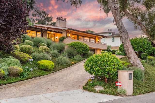 view of front of property with a balcony