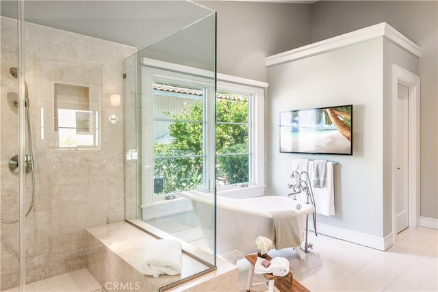 bathroom featuring independent shower and bath, tile patterned floors, and plenty of natural light