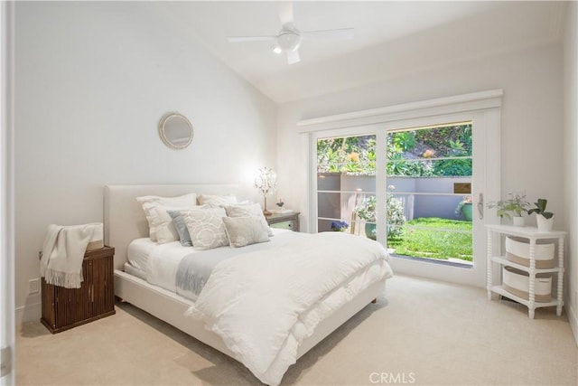 bedroom with ceiling fan, vaulted ceiling, and light carpet