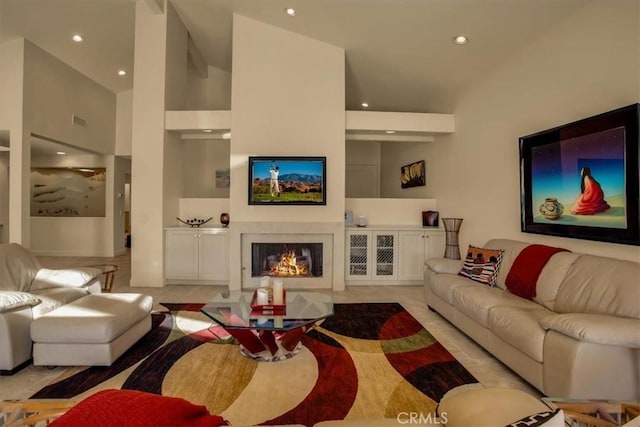 tiled living room with high vaulted ceiling