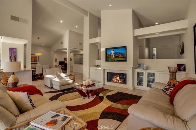 living room featuring high vaulted ceiling