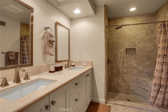 bathroom featuring vanity, tile patterned floors, and a shower with shower curtain