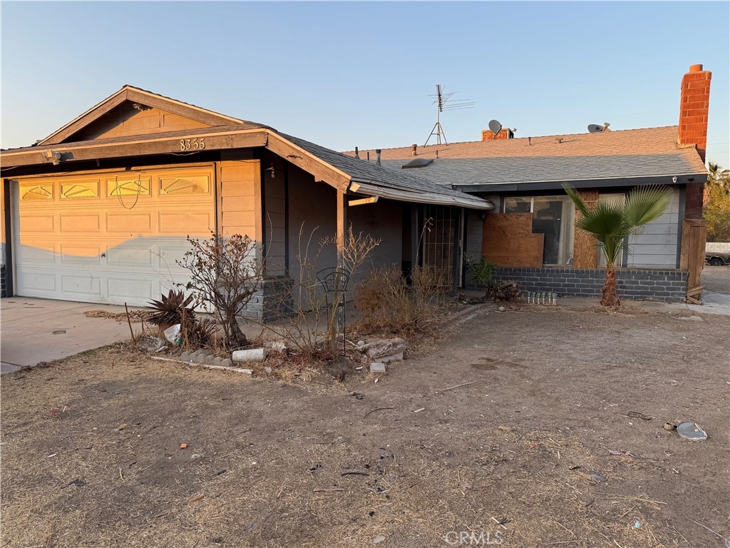 ranch-style house featuring a garage