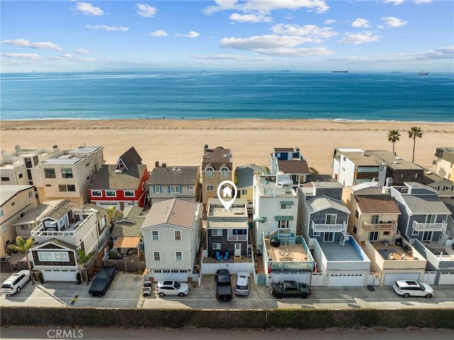 aerial view featuring a view of the beach and a water view