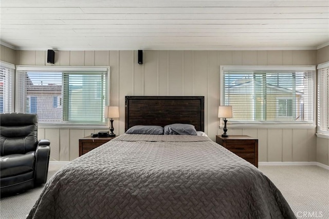 bedroom with multiple windows, carpet floors, and baseboards