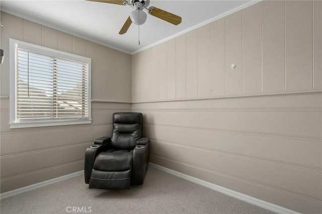 unfurnished room featuring baseboards, ceiling fan, carpet flooring, and crown molding