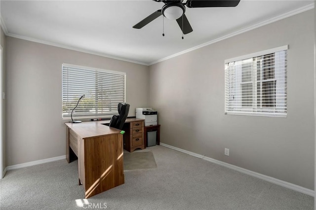 home office with ornamental molding, baseboards, and light carpet