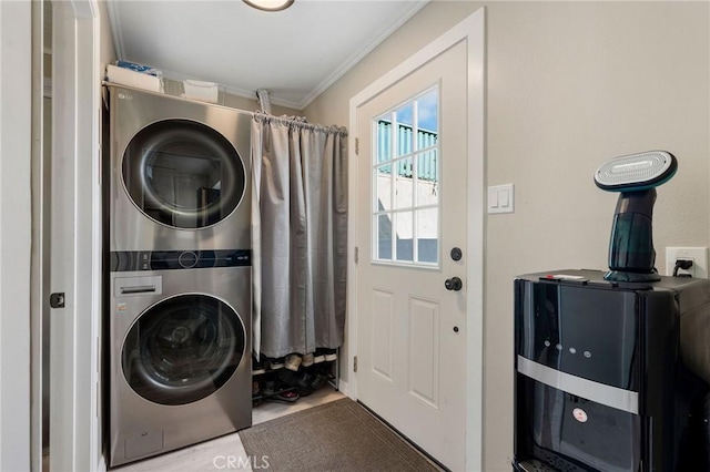 washroom with laundry area, stacked washing maching and dryer, and crown molding