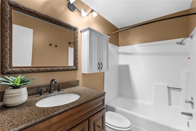 full bathroom featuring toilet, tub / shower combination, and vanity