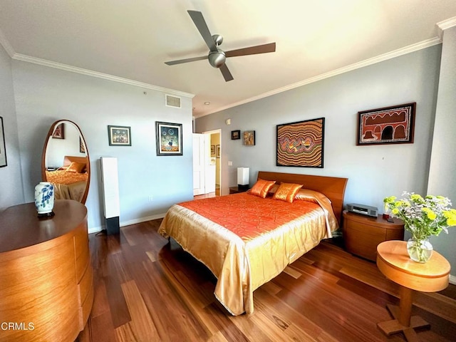 bedroom featuring dark wood-type flooring, ceiling fan, and ornamental molding