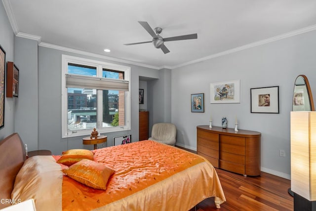 bedroom featuring ornamental molding, hardwood / wood-style floors, and ceiling fan