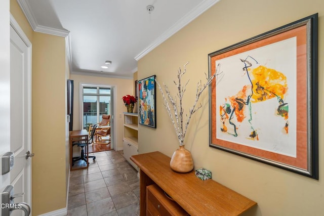 hall with crown molding and light tile patterned floors