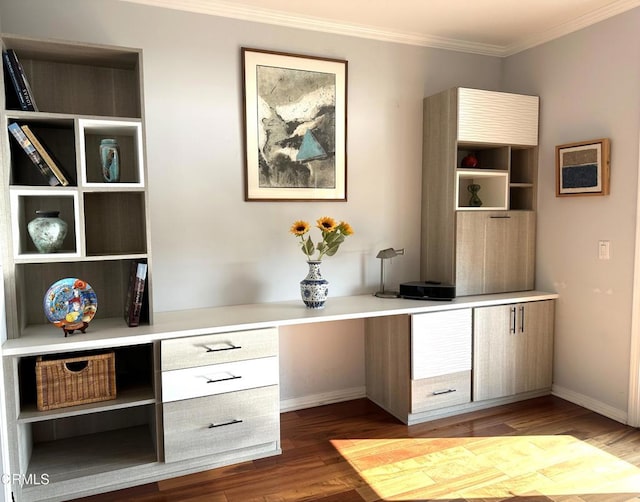 bar featuring hardwood / wood-style flooring, built in desk, and ornamental molding