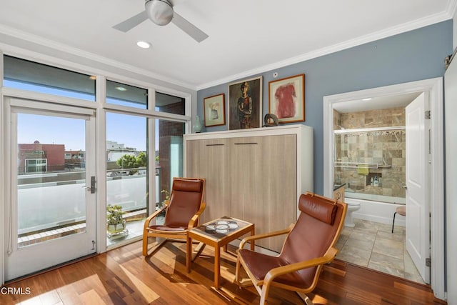 sitting room featuring crown molding, ceiling fan, and light hardwood / wood-style floors