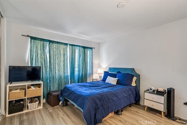 bedroom featuring hardwood / wood-style floors