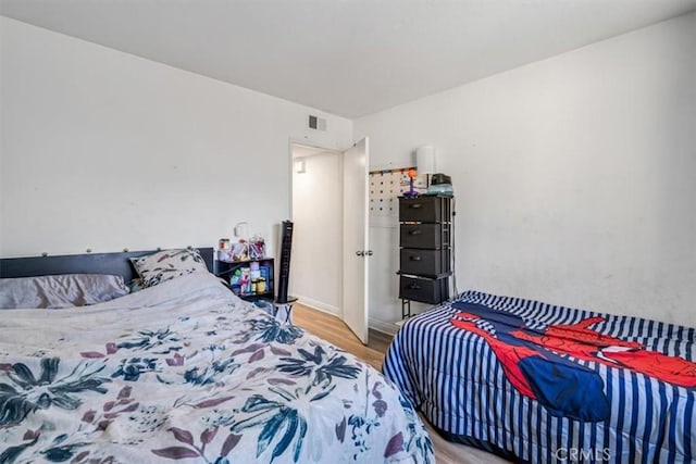 bedroom featuring hardwood / wood-style floors