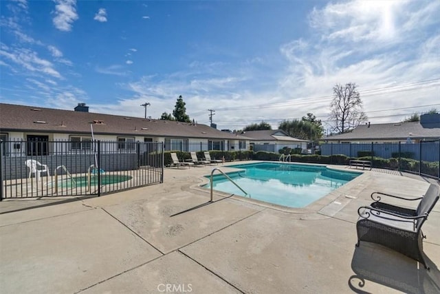 view of swimming pool with a patio area