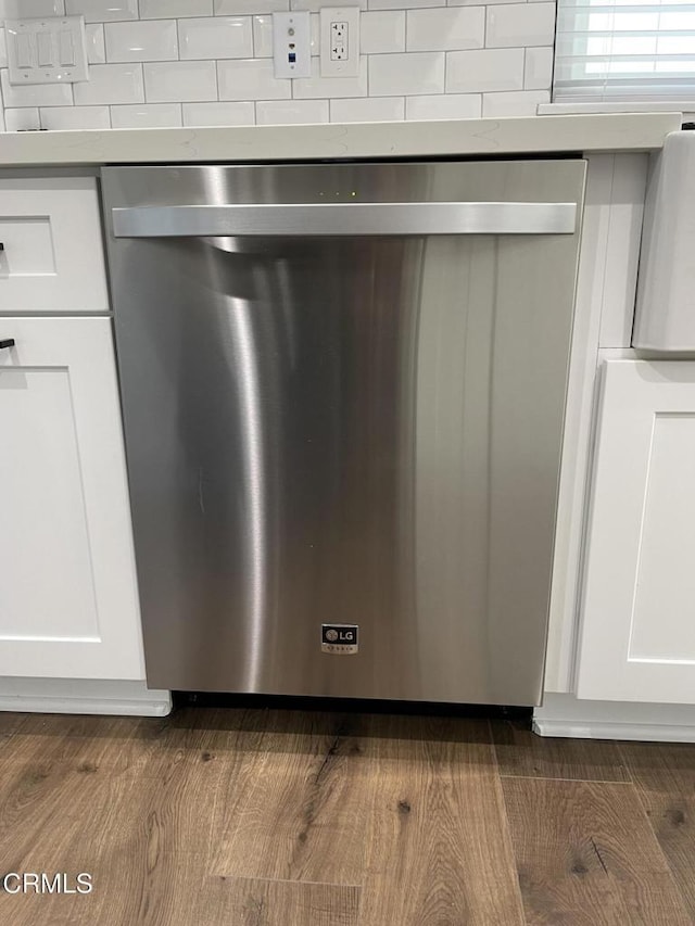 room details with white cabinetry and dishwasher