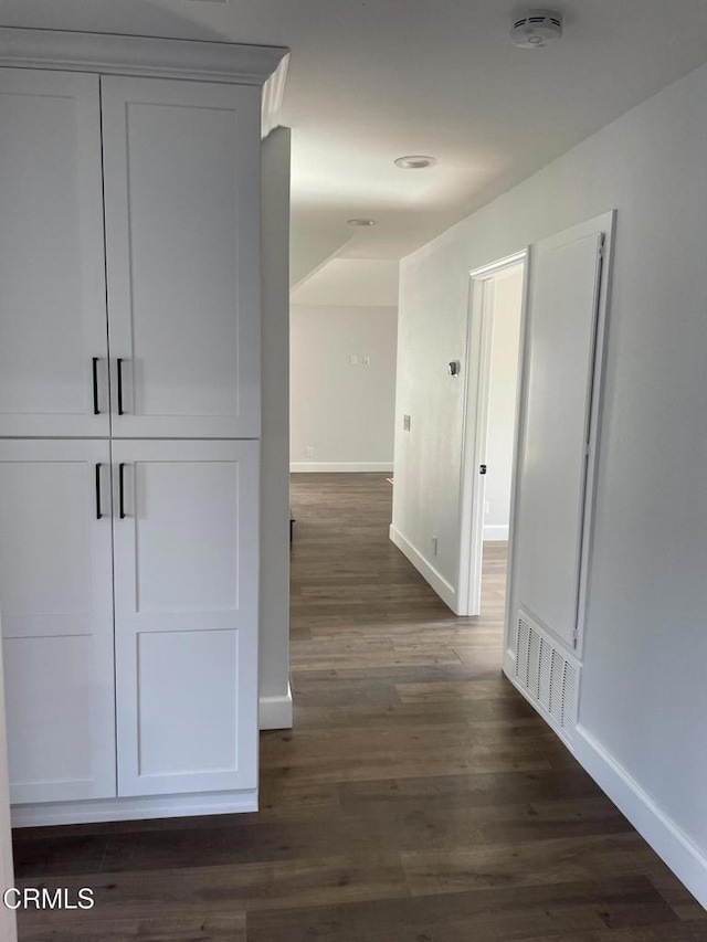 hallway featuring dark wood-type flooring