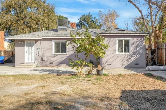 back of house with central AC and a patio area