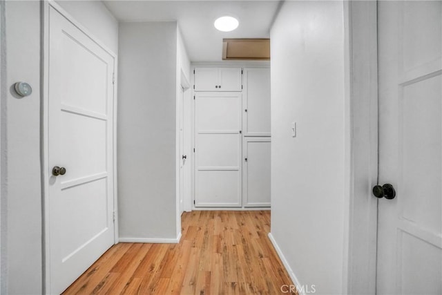 hall with light wood-type flooring