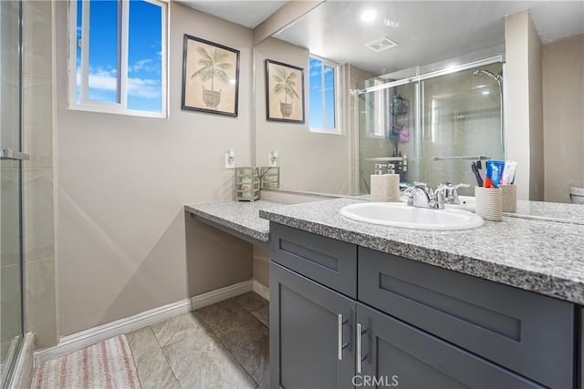 bathroom with walk in shower and vanity