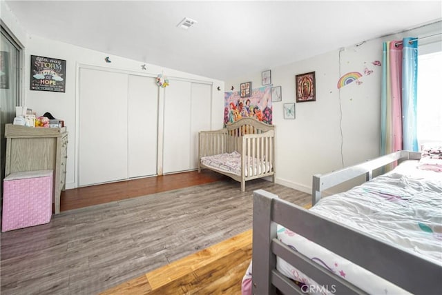 bedroom featuring lofted ceiling and dark wood-type flooring