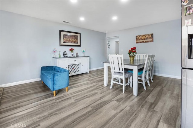 dining room featuring light hardwood / wood-style flooring