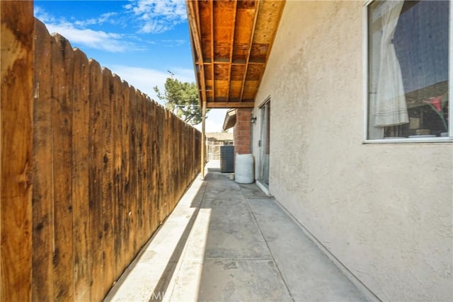 view of side of property with a patio