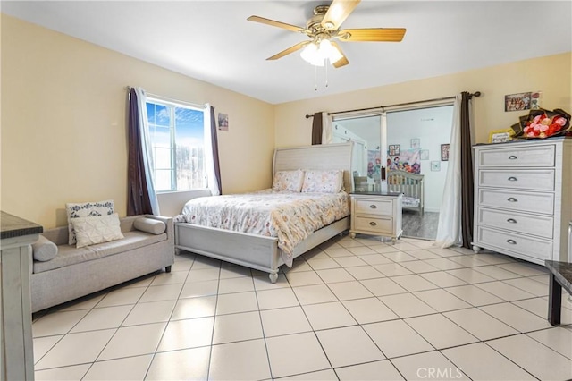 bedroom with ceiling fan and light tile patterned floors