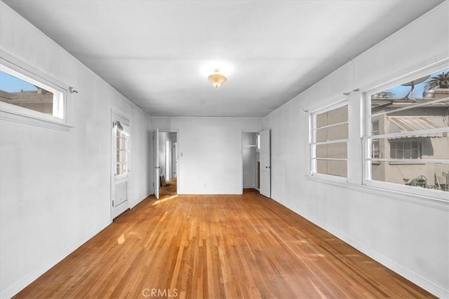 spare room featuring light wood-type flooring