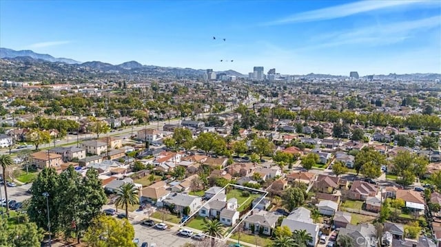 birds eye view of property featuring a mountain view