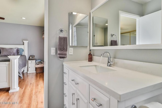 bathroom featuring vanity and hardwood / wood-style floors