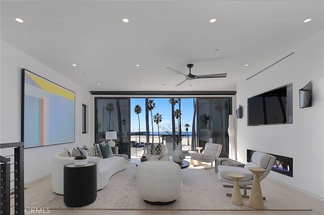 3011 Ocean Front Walk, Venice, CA 90291 - living room with ceiling fan, a warm lit fireplace, and recessed lighting